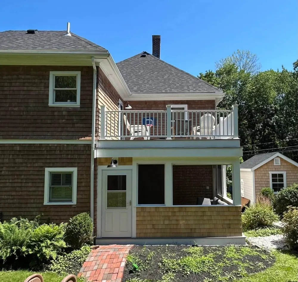 Cedar shingle home with new covered porch and upper deck