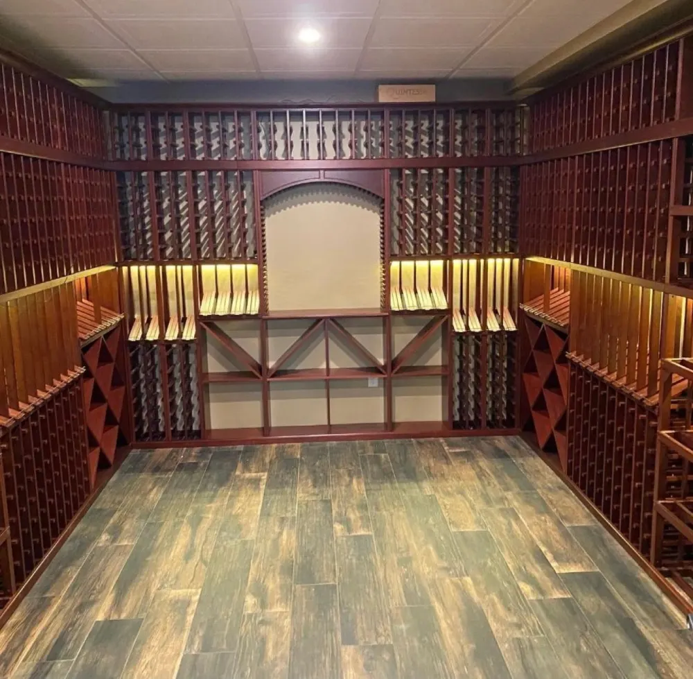Custom wood wine cellar with lit shelving and plank floor